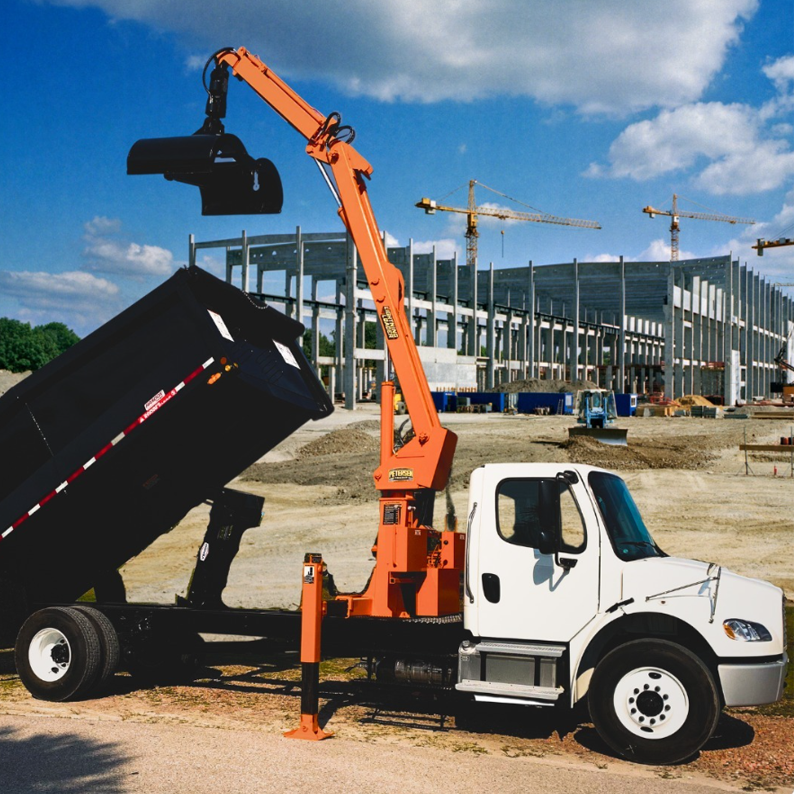 Late-model BTR grapple truck positioned for storm cleanup or job site use