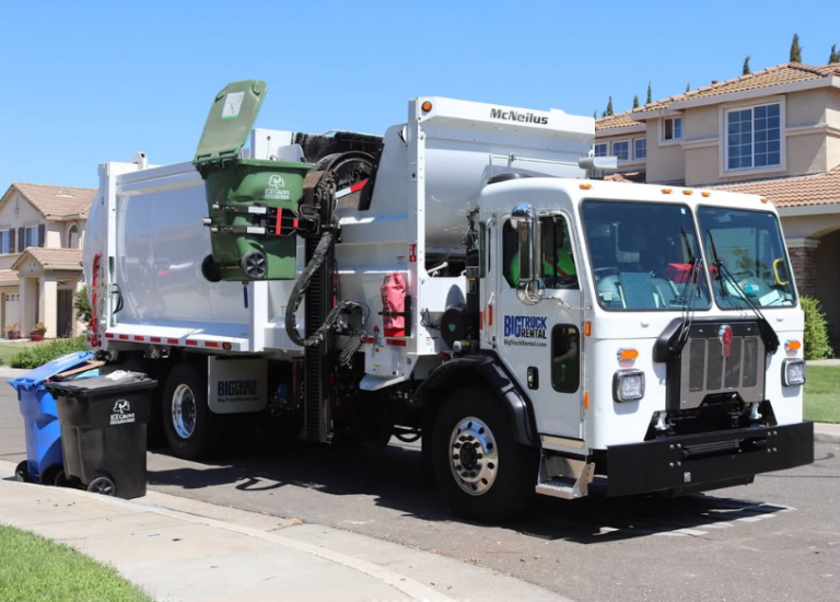 big truck rental side loader operating in residential neighborhood