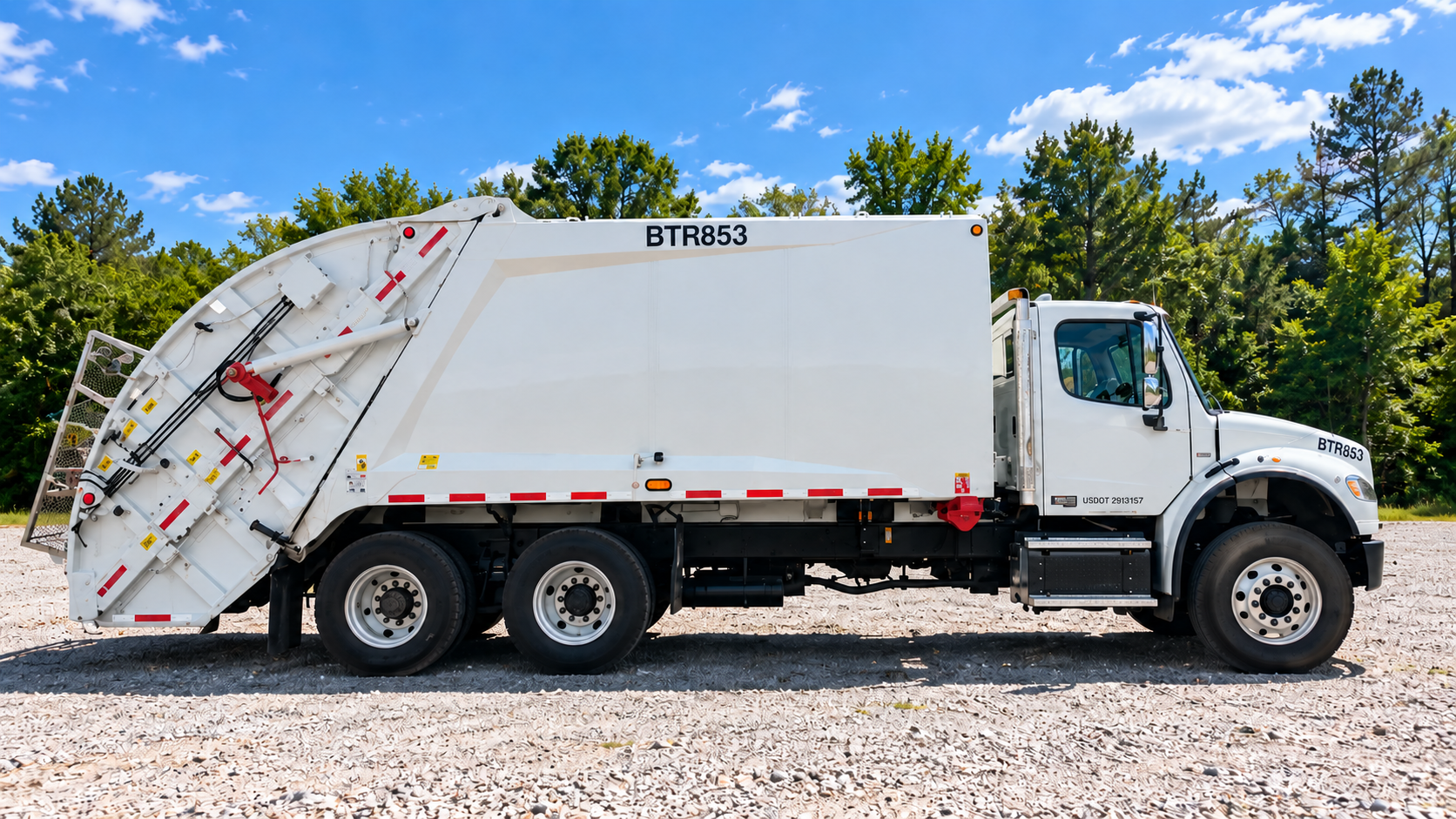 Rear loader in gravel lot