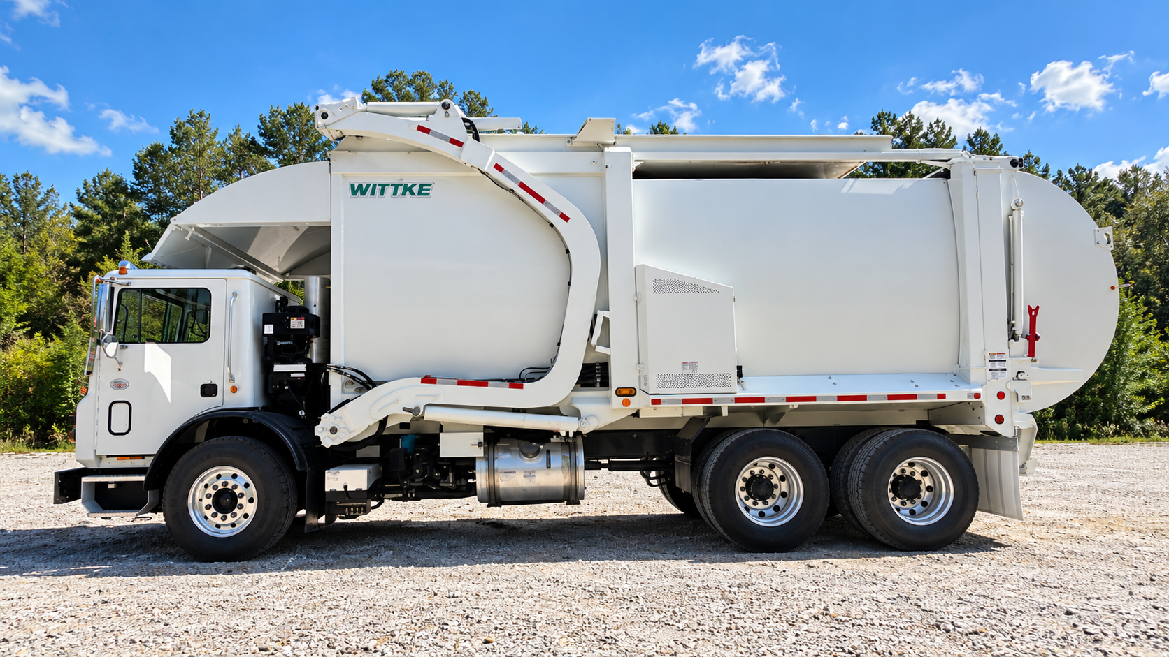 Front Loader garbage truck on gravel lot
