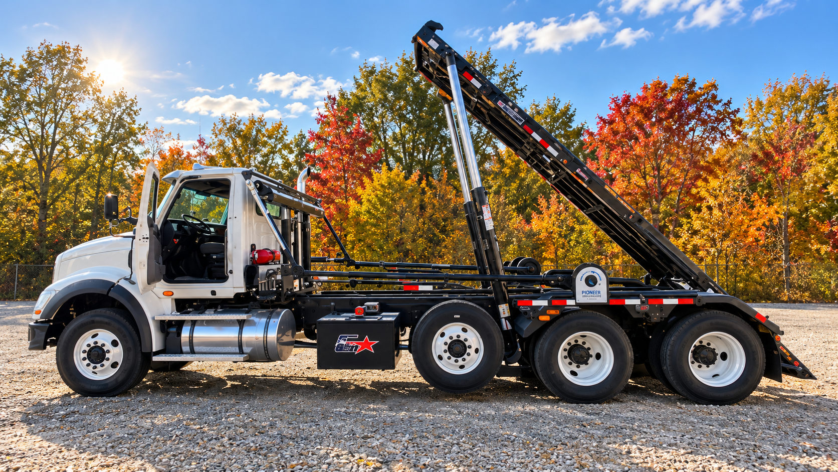 Roll-off truck on gravel lot